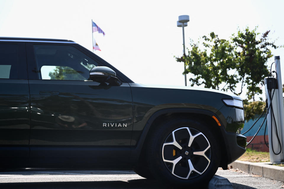 A Rivian R1S electric sports utility vehicle (SUV) charges at a ChargePoint, Inc. public EV charging station in Redondo Beach, California on June 12, 2023. (Photo by Patrick T. Fallon / AFP) (Photo by PATRICK T. FALLON/AFP via Getty Images)