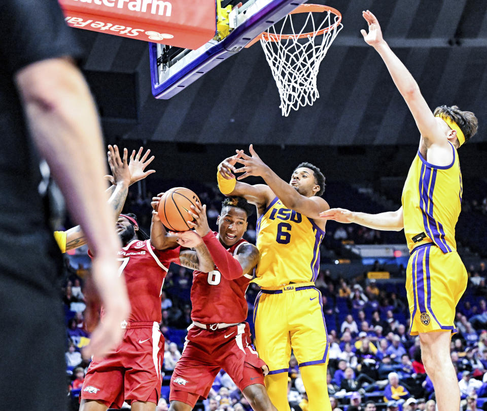 Arkansas guard Layden Blocker (6) secures a rebound while guarded by LSU guard Jordan Wright (6) during an NCAA college basketball game at Pete Maravich Assembly Center, Saturday, Feb. 3, 2024, Baton Rouge, La. (Javier Gallegos/The Advocate via AP)