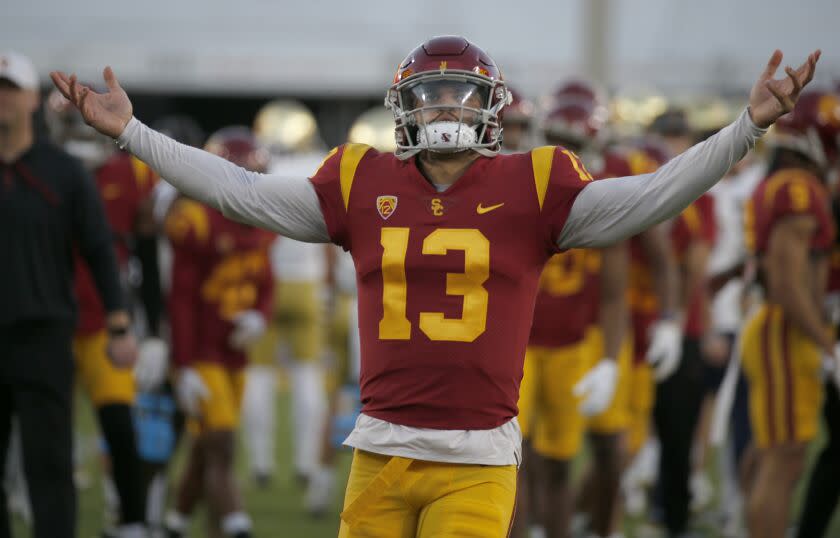 USC quarterback Caleb Williams warms up before playing Notre Dame in the storied football rivalry, held this year at the Los Angeles Memorial Coliseum on Nov. 26, 2022. (Luis Sinco / Los Angeles Times)