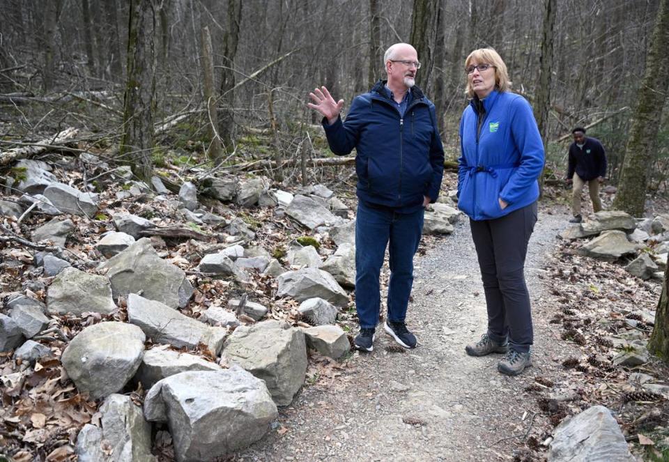 Centre County Commissioner Mark Higgins talks to DCNR secretary Cindy Adams Dunn as she visits Musser Gap Trail on Thursday. This portion of the trail was recently redone and soon 53 miles of new sustainable trails will be built in Rothrock State Forest.