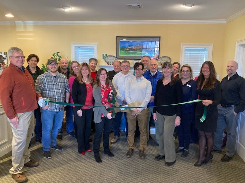 Employees from Granite United Way join GDCC staff, Ambassadors, Board members, and local officials for their ribbon-cutting ceremony at the Chamber.