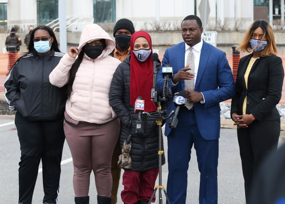The family of Lymond Moses and their attorneys, including (front, from left) Ikia Womack and Lashonnah Nix, two of Moses' sisters, his widow, Amanda Spence, and attorneys Emeka Igwe and Renee Leverette hold a press conference outside the New Castle County police headquarters after the body camera video of the police shooting of Moses was released publicly Tuesday, March 16, 2021.