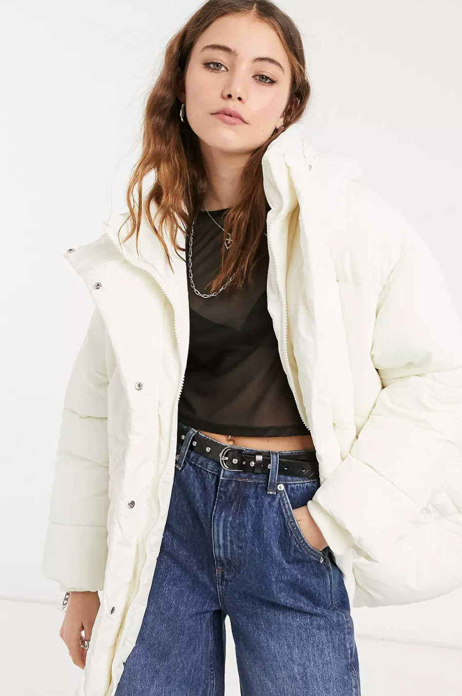 model wearing white puffer with a hood 