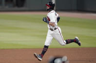 Atlanta Braves shortstop Dansby Swanson rounds the bases after hitting a three-run home run in the fourth inning of a baseball game against the Miami Marlins Wednesday, Sept. 23, 2020, in Atlanta. (AP Photo/John Bazemore)