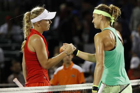 Mar 28, 2017; Miami, FL, USA; Caroline Wozniacki of Denmark (L) shakes hands with against Lucie Safarova of the Czech Republic (R) on day eight of the 2017 Miami Open at Crandon Park Tennis Center. Wozniacki won 6-4, 6-3. Mandatory Credit: Geoff Burke-USA TODAY Sports