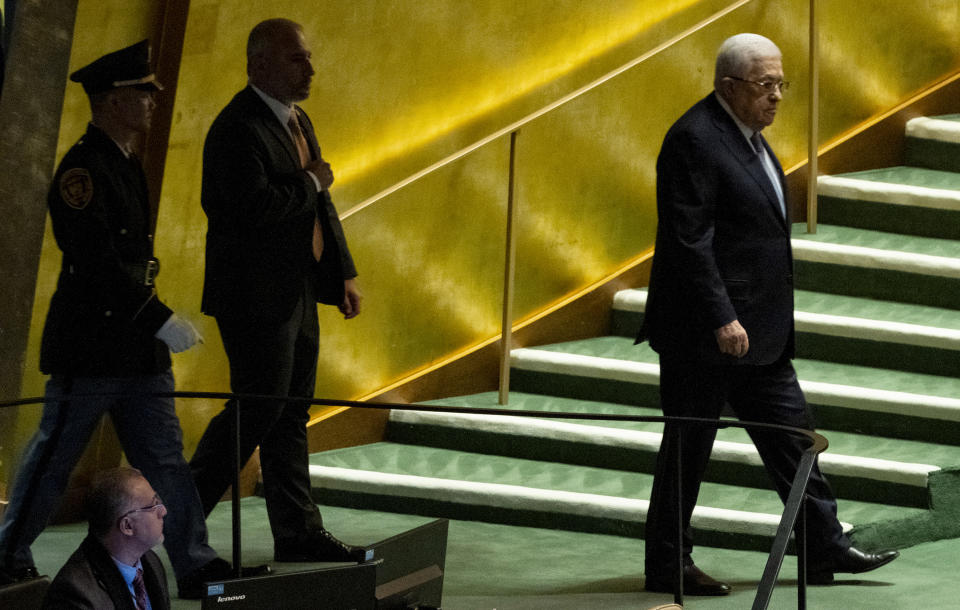Palestinian President Mahmoud Abbas walks towards the podium to address the 78th session of the United Nations General Assembly, Thursday, Sept. 21, 2023. (AP Photo/Craig Ruttle)