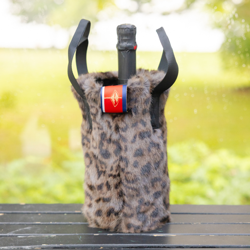 <p><a href="https://go.redirectingat.com?id=74968X1596630&url=https%3A%2F%2Fprettyruggedshop.com%2Fproducts%2Fluxe-faux-fur-grey-leopard-wine-tote&sref=https%3A%2F%2Fwww.thepioneerwoman.com%2Fhome-lifestyle%2Fentertaining%2Fg32293314%2Fhostess-gifts-ideas%2F" rel="nofollow noopener" target="_blank" data-ylk="slk:Shop Now;elm:context_link;itc:0;sec:content-canvas" class="link ">Shop Now</a></p><p>The Rowling Grey Leopard Faux Fur Wine Tote</p><p>prettyruggedshop.com</p><p>$30.00</p><span class="copyright">Pretty Rugged</span>