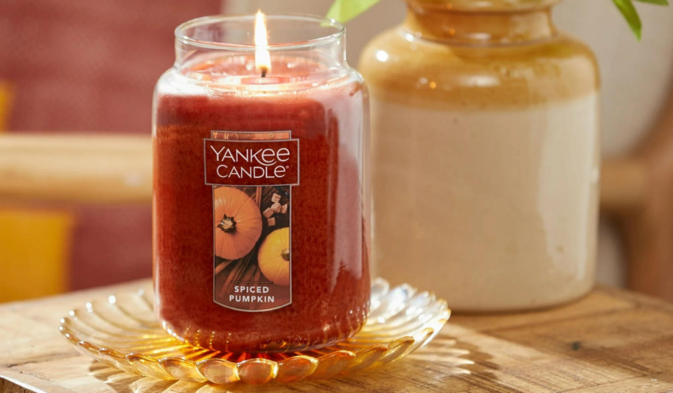 Yankee Candle Spiced Pumpkin large jar candle lit on a table