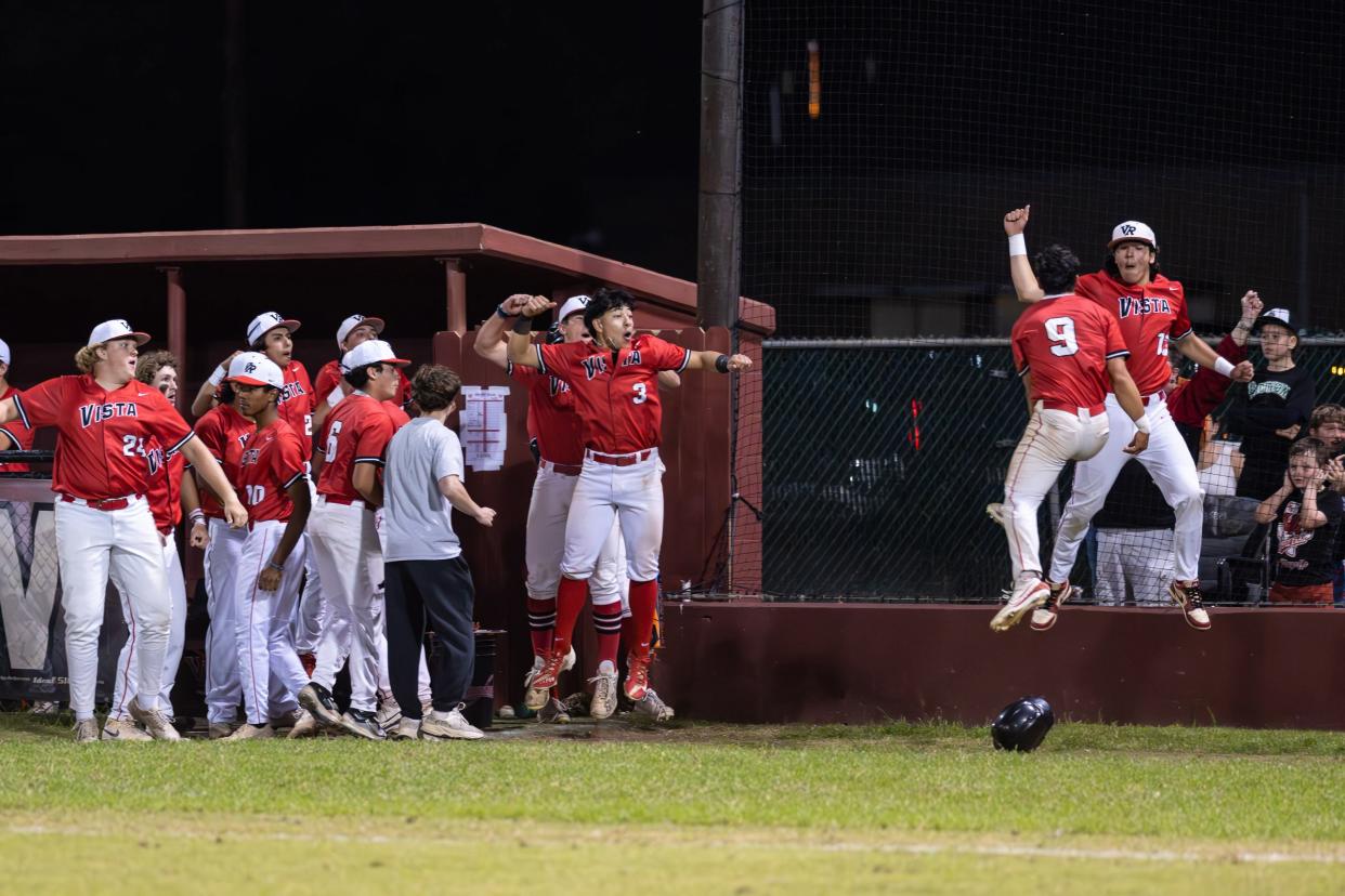 Isaac Garcia (9) celebrates with Vista Ridge teammates after scoring the go-ahead run in the top of the eighth. Vista Ridge won a district baseball game at Round Rock, 2-1 in eight innings, on April 23, 2024.