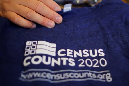 T-shirts are displayed at a community activists and local government leaders event to mark the one-year-out launch of the 2020 Census efforts in Boston