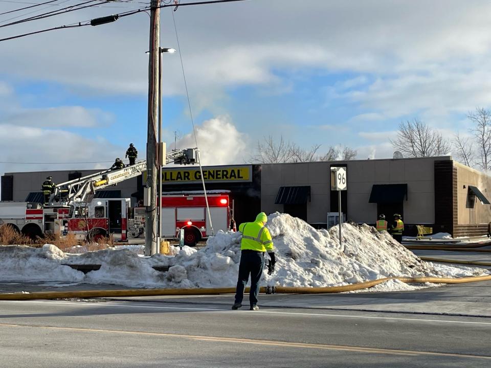 A portion of state Route 96 was closed as fire crews battle a fire Thursday afternoon at the Dollar General store in Farmington.