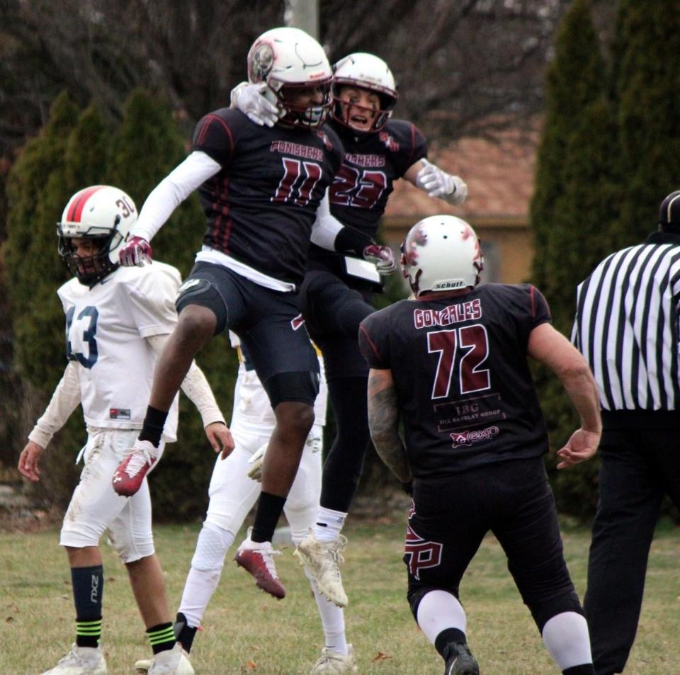 Peoria Punishers receivers Kenny King (11) and Austin Kingsley celebrate a touchdown during the 2023 season. They'll try to help Peoria's semipro football team to a national title in a game at Minnesota on Sept. 30, 2023.