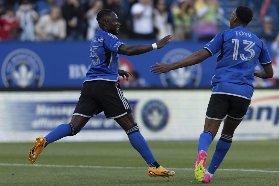 CF Montreal defender Zachary Brault-Guillard (15) celebrates after his goal with teammate Mason Toye (13) during first-half MLS soccer match action against Minnesota United in Montreal, Saturday, June 10, 2023. (Evan Buhler/The Canadian Press via AP)