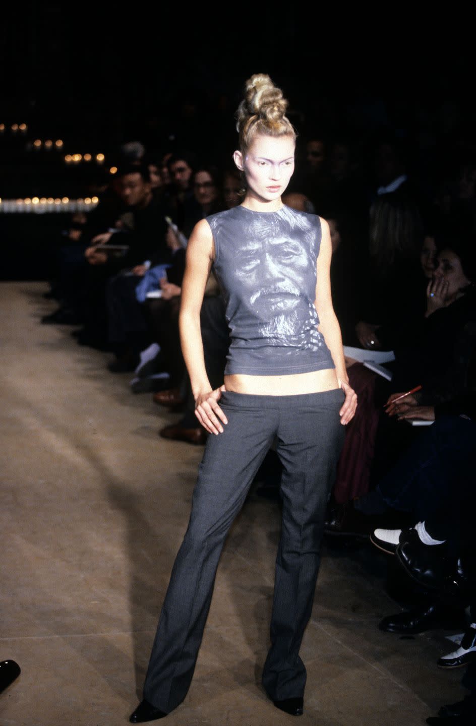 kate moss wearing sleeveless photo print top with low rise black trousers in the alexander mcqueen fallwinter 1996 ready to wear show in new york photo by john aquinowwdpenske media via getty images