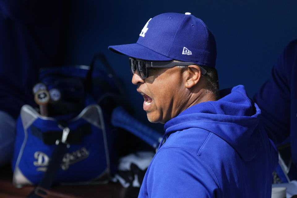 FILE - Los Angeles Dodgers manager Dave Roberts shouts in the dugout prior to a spring training baseball game against the Arizona Diamondbacks, March 2, 2023, in Phoenix. (AP Photo/Ross D. Franklin, File)