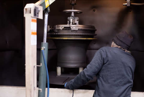 Figure 1: Barnes Aerospace employee inspects the shot peening machine at the Barnes Aerospace East Granby MRO facility in Connecticut. (Photo: Business Wire)