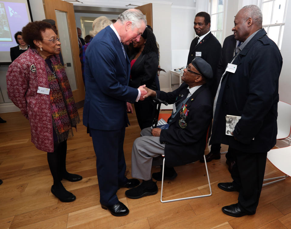 LONDON, ENGLAND - FEBRUARY 16: Prince Charles, The Prince of Wales meets veteran Allan Wilmot (centre) amongst other veterans during his visit to the Black Cultural Archives in Brixton on February 16, 2017 in London, England.  (Photo by Jonathan Brady / WPA Pool - Getty Images)