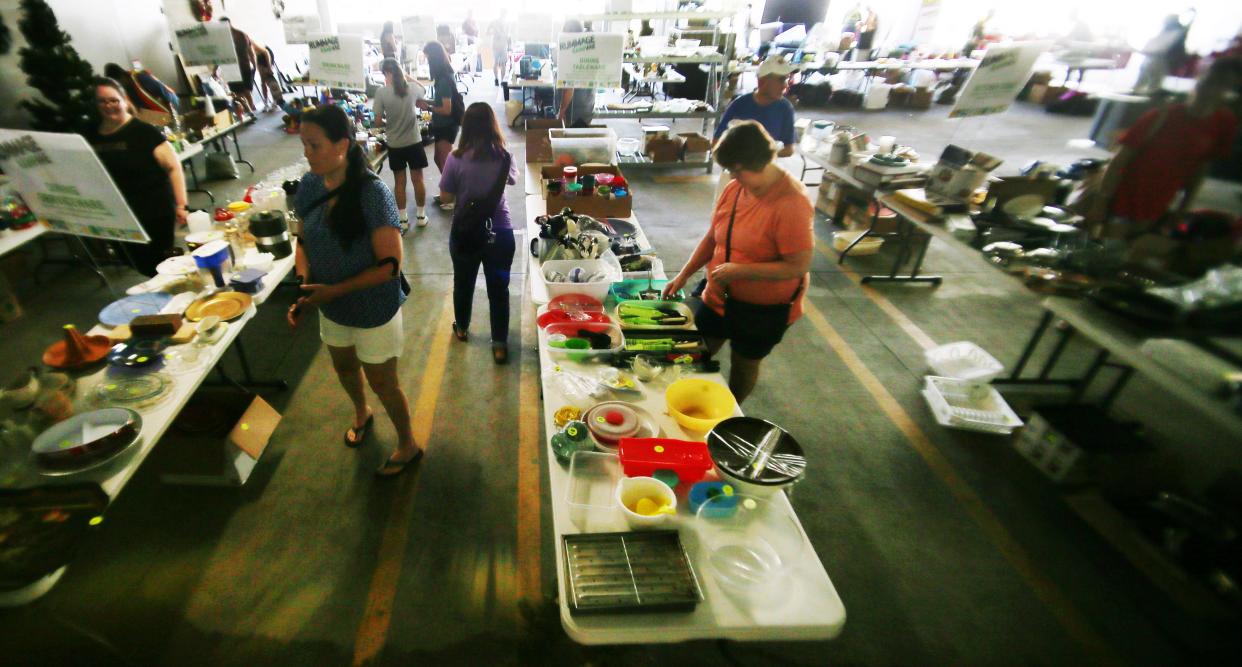 People browse at the Rummage RAMPage, a week-long community garage sale designed to keep reusable items out of the waste stream, at Ames Intermodal Facility in Campustown on Monday, July 31, 2023, Ames, Iowa.