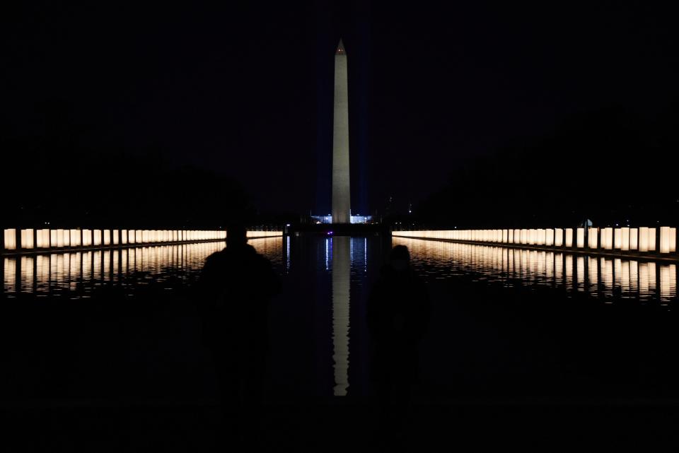 Lights illuminated the Reflecting Pool after President-elect Joe Biden hosted a memorial to honor those who have died in the U.S. from the coronavirus. (Callaghan O'Hare / Reuters)