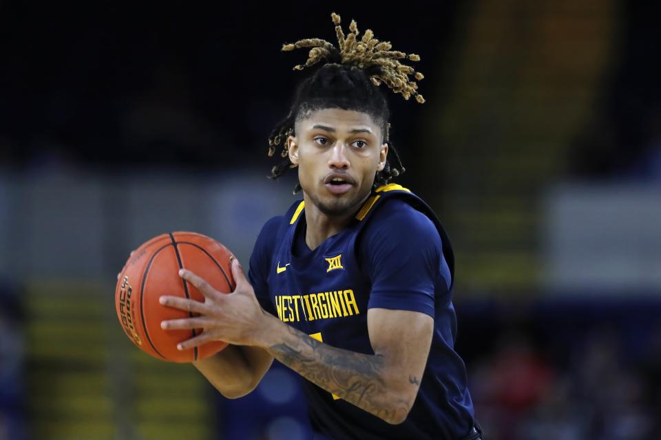 West Virginia's Noah Farrakhan plays against Massachusetts during the first half of an NCAA college basketball game in the Basketball Hall of Fame Classic, Saturday, Dec. 16, 2023, in Springfield, Mass. (AP Photo/Michael Dwyer)