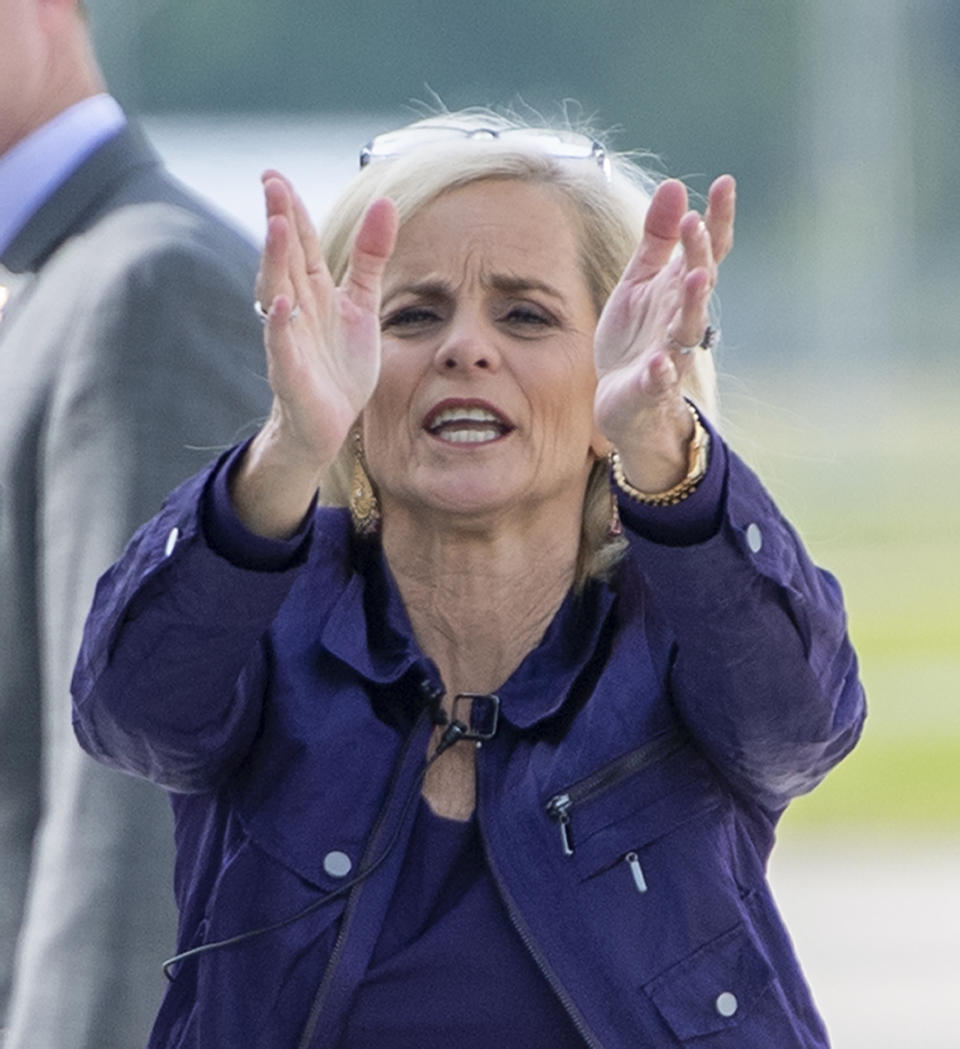 Former Baylor women's basketball coach Kim Mulkey waves the folks behind the fence after arriving at Metro Airport to become LSU's women's basketball coach Monday, April 26, 2021, in Baton Rouge, La. (Bill Feig/The Advocate via AP)