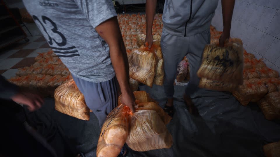 A bakery prepares rations of bread to pass out to internally displaced Palestinians in the southern Gaza Strip on October 17, 2023.  - Mohammed Abed/AFP/Getty Images