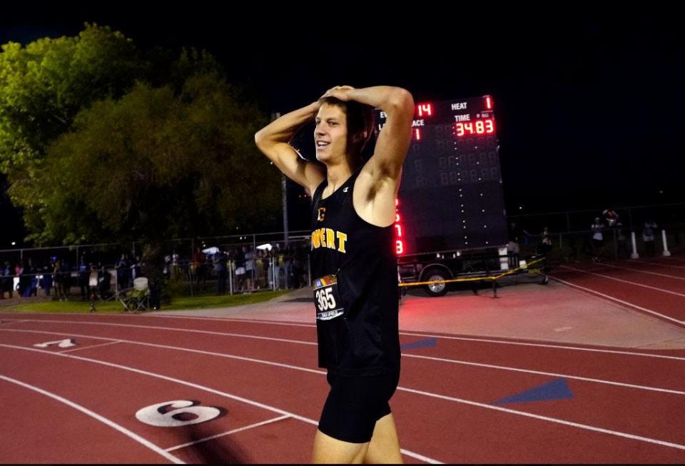 Gilbert High's Vance Nilsson after breaking the national high school record in the 300M hurdles during Saturday's AIA state high school track and field championships at Mesa Community College on May 11, 2024.