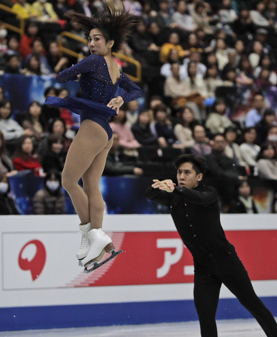 China's Sui Wenjing and Han Cong perform their pairs free skate during the ISU World Figure Skating Championships at Saitama Super Arena in Saitama, north of Tokyo, Thursday, March 21, 2019. (AP Photo/Andy Wong)