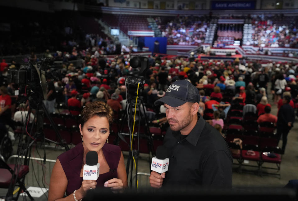 Gubernatorial candidate Kari Lake speaks to Real America's Voice network before former President Donald Trump takes the stage at Findlay Toyota Center in Prescott Valley, Ariz. on Friday, July 22, 2022.