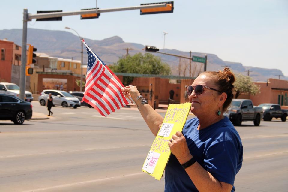 A protester holding a sign and a flag at the We Trust Women rally May 14, 2022.

We Trust Women held a protest on May 14, 2022 on the corner of 10th Street and White Sands Boulevard to bring awareness to women's rights.