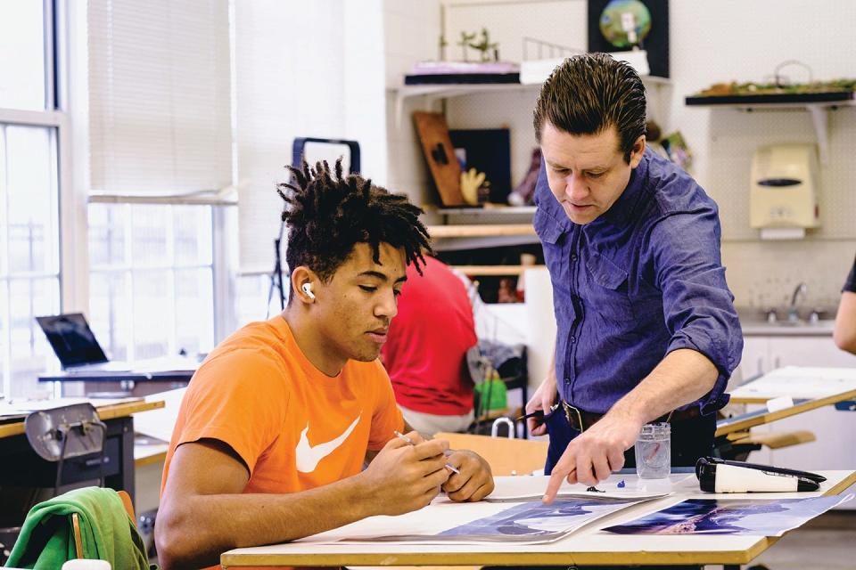Wabash College art professor Damon Mohl, right, works closely with a student in an introductory art class on the Crawfordsville, Ind., campus.