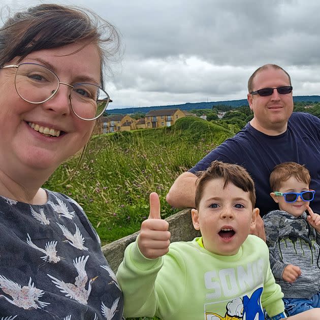 The author (left) pictured with her son Harry (age 7), James (age 4) and husband Luke.