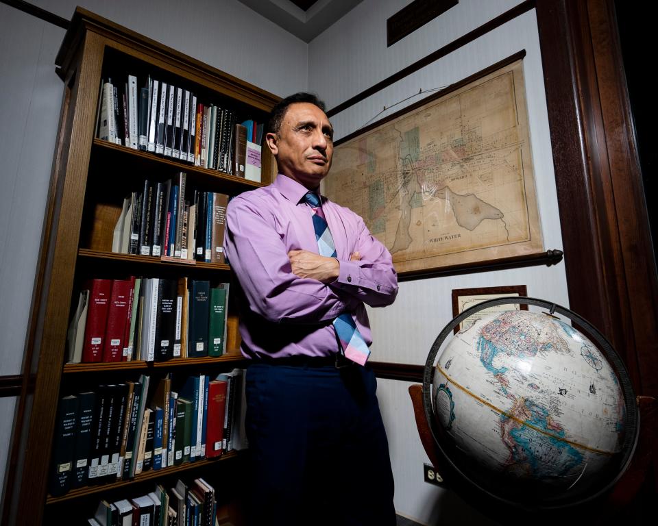 Jorge Islas-Martinez, a longtime advocate for immigrants, has been frustrated with the tenor of the discussion around the influx of about 800 to 1,000 migrants to Whitewater in the last two years. He poses for a portrait Wednesday January 10, 2024 at the Irvin L. Young Memorial Library in Whitewater.