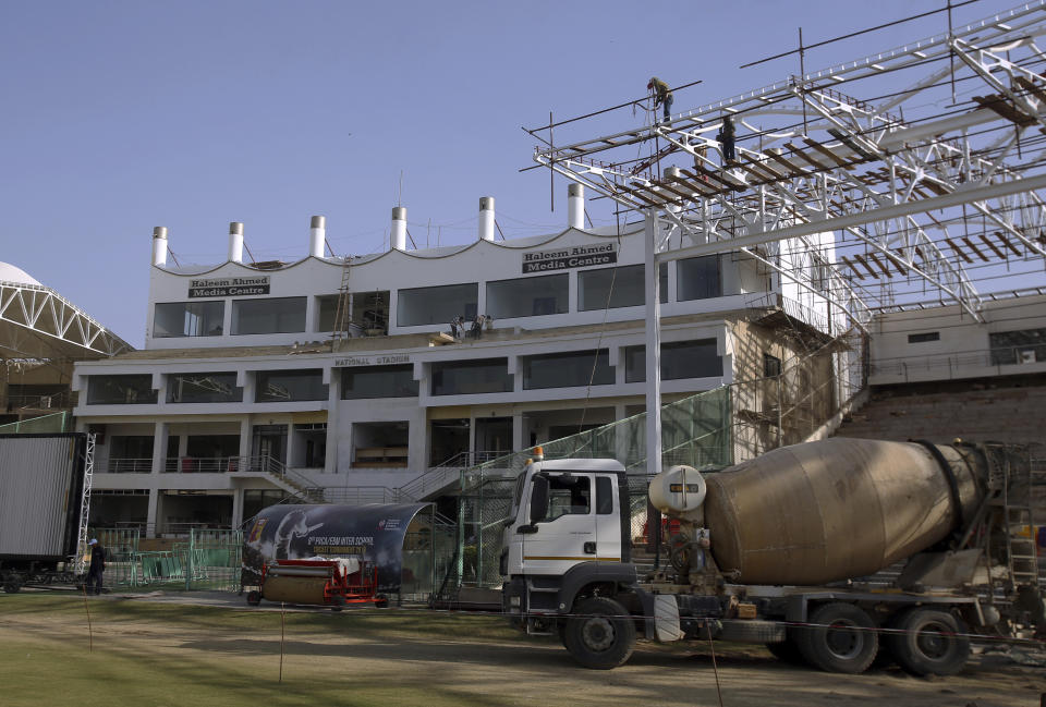 In this Feb. 9, 2019 photo, a renovation of National Stadium is in progress for the upcoming Pakistan Super League in Karachi, Pakistan. A Pakistan army soldier stands guard during the Pakistan Super League match at Gaddafi stadium in Lahore, Pakistan. The Pakistan Super League is not like any other domestic Twenty20 cricket league around the world. It can't compete financially with the lucrative Indian Premier League in terms of player payments, yet it's a dream for Pakistani cricketer to be part of it. For the Pakistan Cricket Board, the PSL is a pathway to ultimately bring foreign teams back to Pakistan and resume fully-fledged international cricket on home soil. (AP Photo/Fareed Khan)