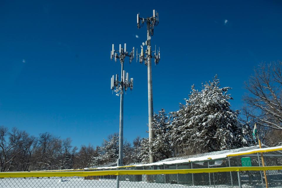 A pair of cell towers located at City Park overlook the ball field on Feb. 3.