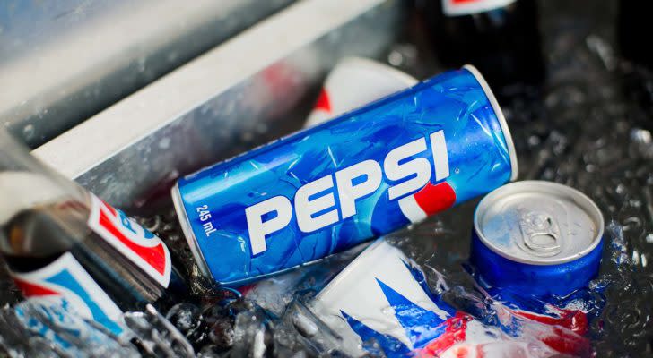 Cans of PepsiCo's Pepsi soda are in a bucket of ice.