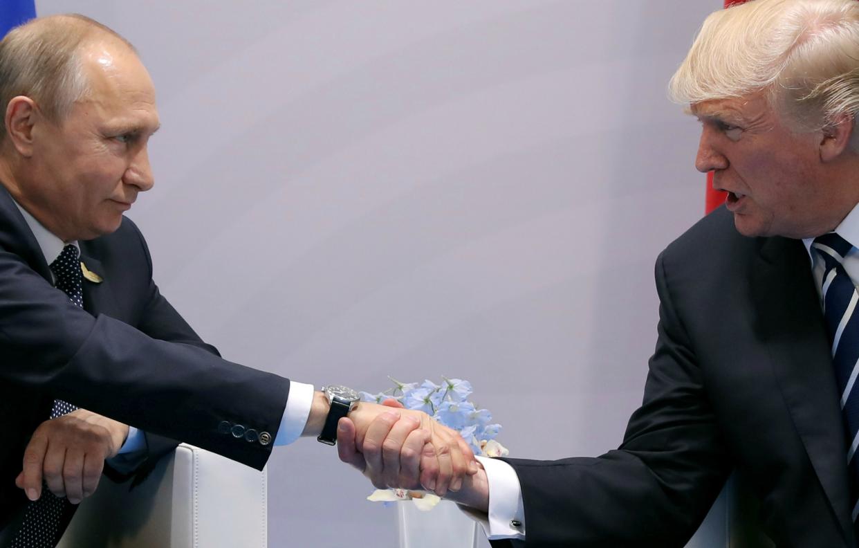 President Donald Trump shakes hands with Russian President Vladimir Putin during the their bilateral meeting: REUTERS/Carlos Barria