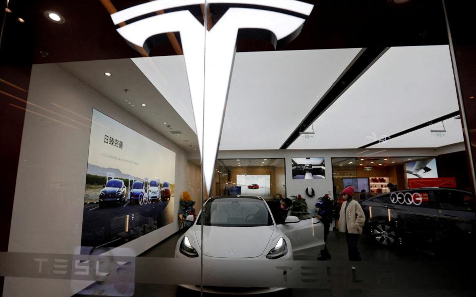 A Tesla Model 3 and Model y - the only models the company makes in China - on display at a showroom in Beijing