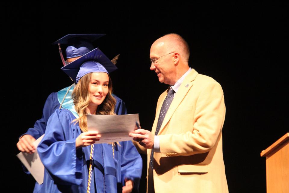 Kaitlyn Leber receives a Tom Lipovac Award from Clark Wicks during the Senior Awards Assembly on Wednesday, May 15, 2024, at Perry Performing Arts Center.