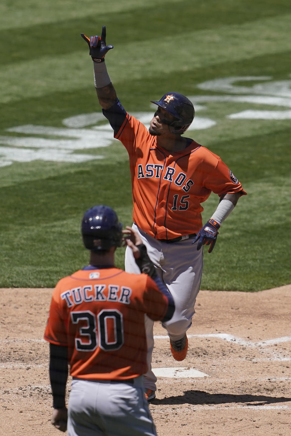 Houston Astros' Martin Maldonado (15) celebrates after hitting a two-run home run that scored Kyle Tucker (30) in the fourth inning of a baseball game against the Oakland Athletics in Oakland, Calif., Thursday, May 20, 2021. (AP Photo/Jeff Chiu)