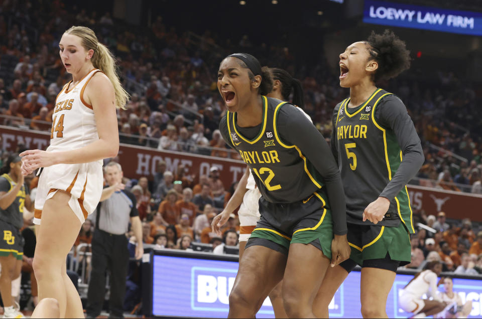 Baylor forwards Kyla Abraham (12) and Darianna Littlepage-Buggs yell after a foul by Texas in the first half of an NCAA college basketball game, Monday, Feb. 27, 2023, in Austin, Texas. Texas forward Taylor Jones (44) looks on. (Rod Aydelotte/Waco Tribune-Herald via AP)