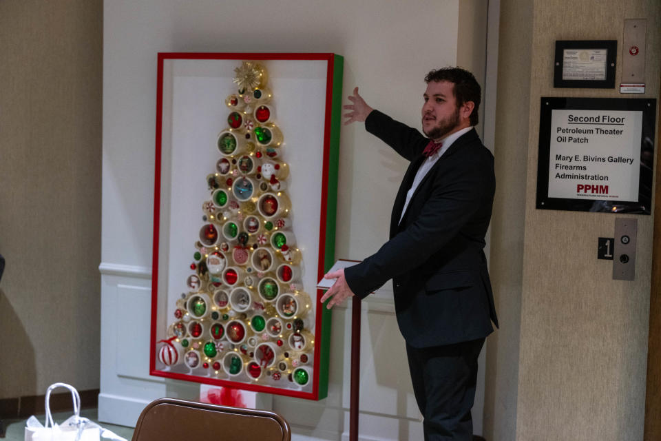 A wall-mounted Christmas tree is being showcased as one of the many unique Christmas trees auctioned off at the "Tree of Tidings" fundraiser Thursday night at the Panhandle-Plains Historical Museum in Canyon.