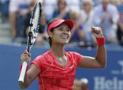 Li Na of China celebrates after defeating Ekaterina Makarova of Russia at the U.S. Open tennis championships in New York September 3, 2013. REUTERS/Ray Stubblebine