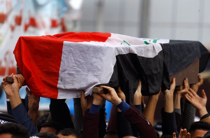 Mourners carry the coffin during the funeral of a demonstrator who was killed at an anti-government protest overnight in Najaf