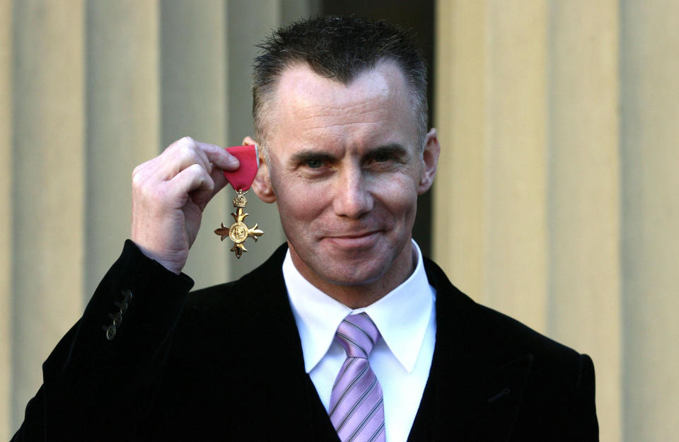 Chef Gary Rhodes proudly shows off his OBE awarded for services to the hospitality industry in Buckingham Palace, in central London following an Investiture cremony held by the Queen.