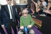 <p><a rel="nofollow" href="https://www.yahoo.com/entertainment/stan-lee-accused-sexual-misconduct-massage-therapist-lawsuit-213330980.html" data-ylk="slk:Despite his latest offscreen drama;elm:context_link;itc:0;sec:content-canvas;outcm:mb_qualified_link;_E:mb_qualified_link;ct:story;" class="link  yahoo-link">Despite his latest offscreen drama</a>, the Marvel mastermind zipped in for the big event. (Photo: Charley Gallay/Getty Images for Disney) </p>