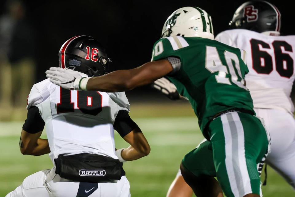 Dutch Fork Silver Foxes defensive end Josh Smith (40) sacks Boiling Springs Bulldogs quarterback Lincoln Huskey (16) in their first round 5A Upper State playoff game at Dutch Fork High School Friday, November 3, 2023.