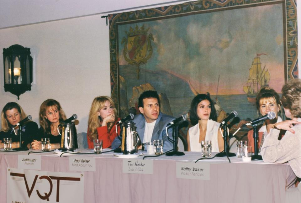A panel of celebrities including Judith Light, Paul Reiser, Teri Hatcher, and Kathy Baker sitting in front of microphones.