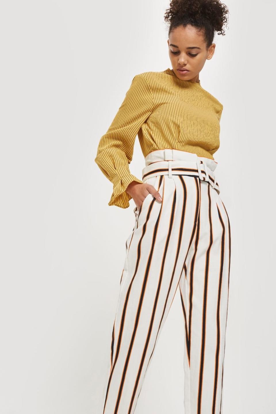 Get them at <a href="http://us.topshop.com/en/tsus/product/multi-coloured-stripe-tapered-trousers-7490514?bi=20&amp;ps=20" target="_blank">Topshop</a>, $85.