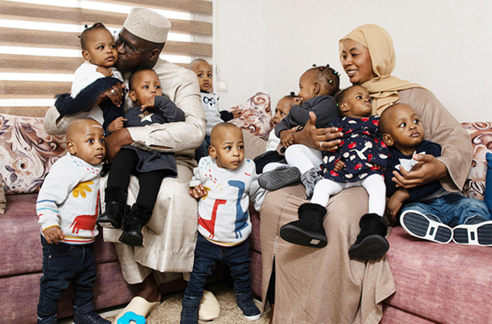 Mom Halima Cissé and dad Abdelkader Arby are pictured with all nine toddlers, who were born on were born May 4, 2021. (Guinness World Records)